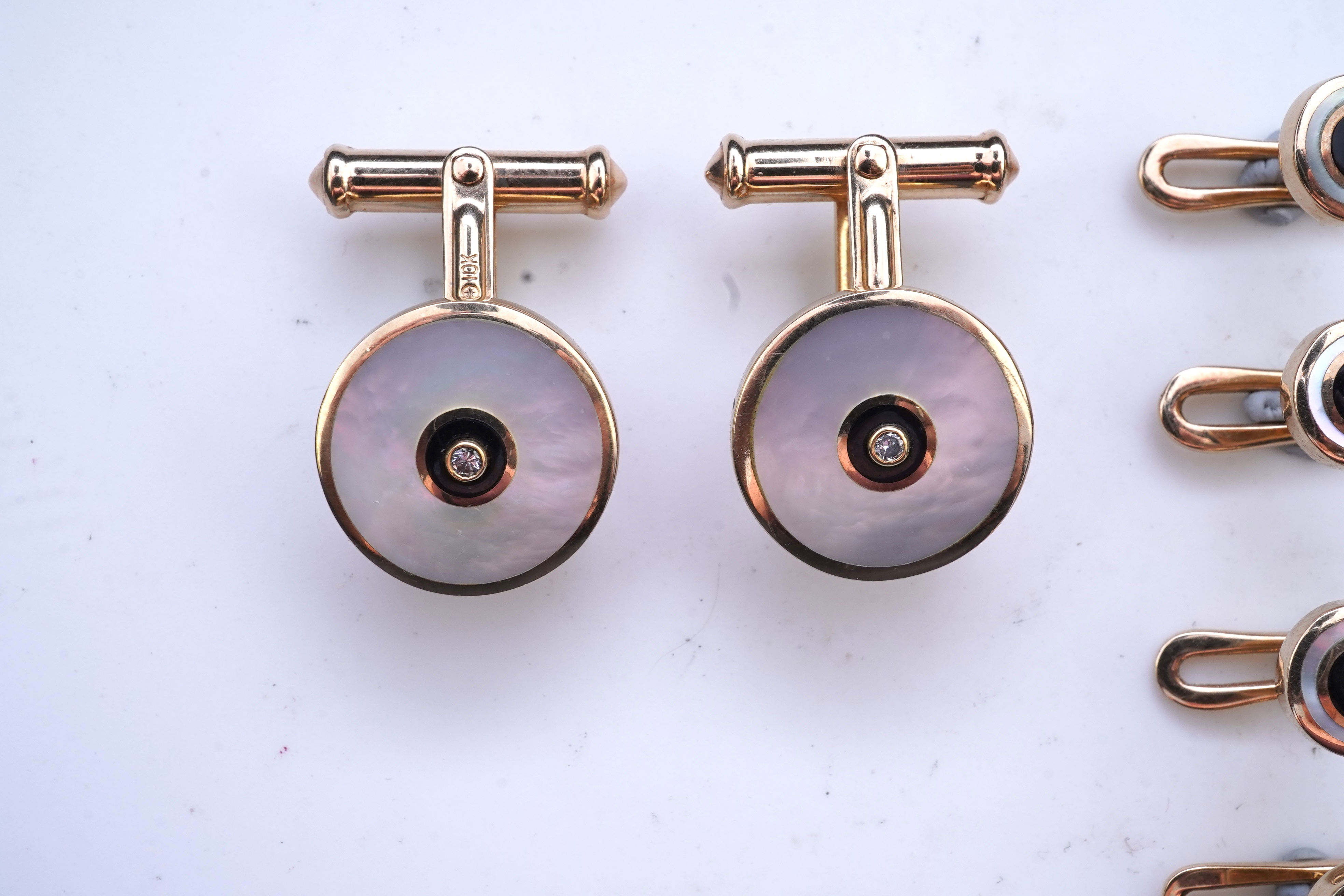 A mother of pearl and diamond dress set